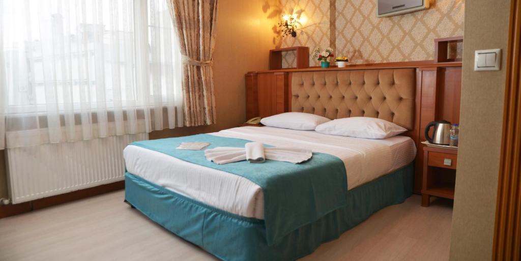 Postel nebo postele na pokoji v ubytování Old City Viva Hotel