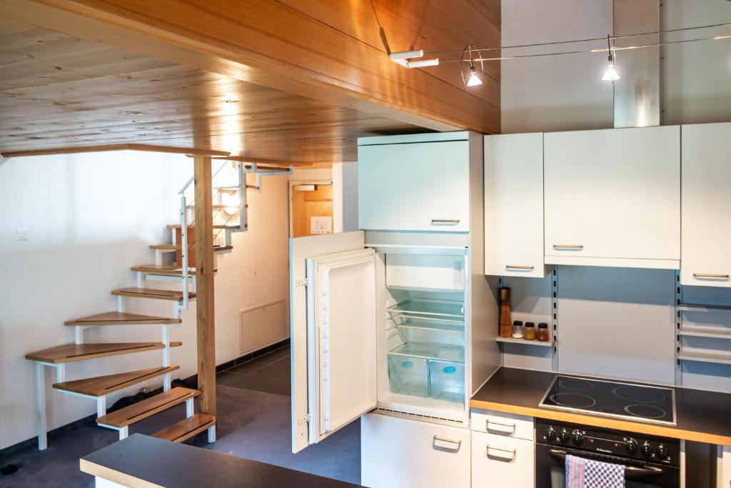 Kuchyň nebo kuchyňský kout v ubytování Hotel Gletscherblick Grindelwald