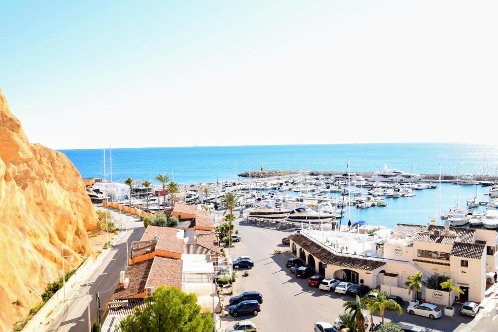 a marina with a bunch of boats in the water at Sunny Escape by the Sea & Yacht Club in Altea