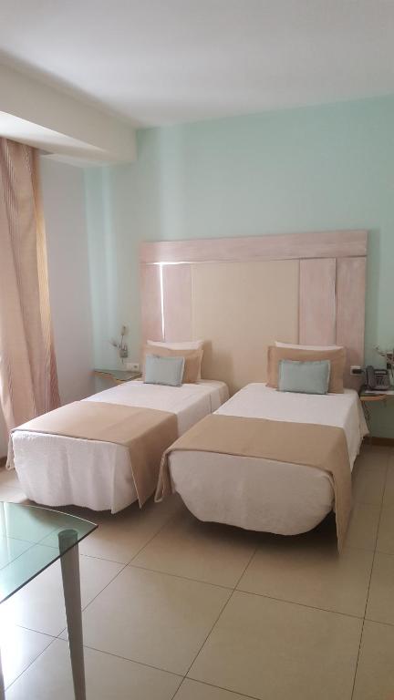 Postel nebo postele na pokoji v ubytování Sol Hotel
