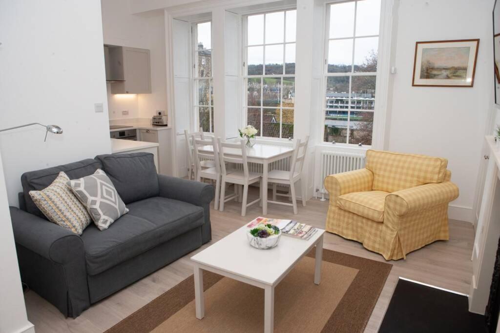 a living room with a couch and chairs and a table at Stunning, 1 Bed Luxury Flat in Central Bath in Bath