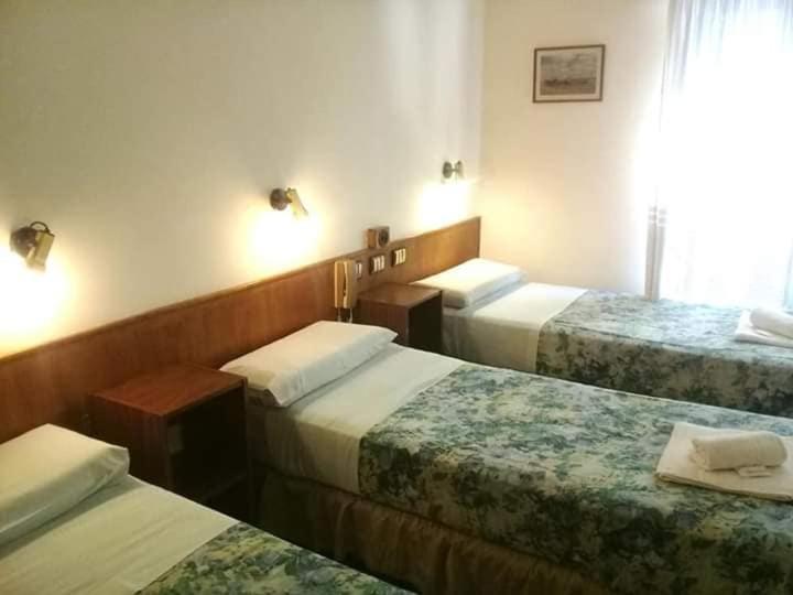 Cama ou camas em um quarto em Hotel San Miguel