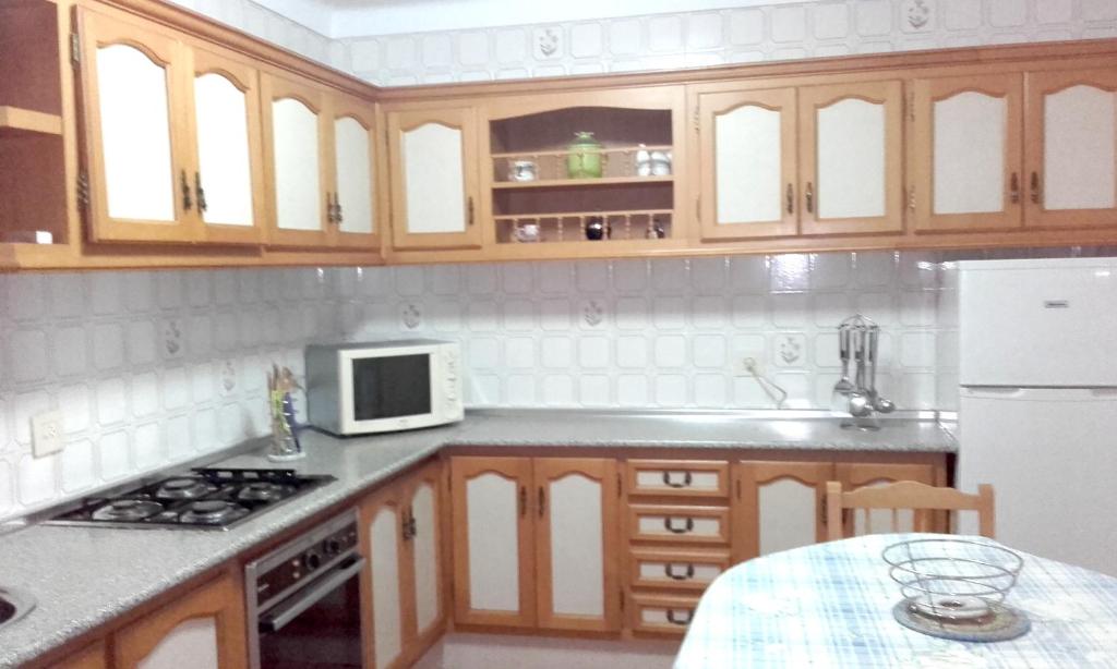 A kitchen or kitchenette at Modern Apartment in Nerja with Sea View, 90 sqm