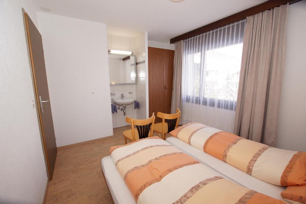 Postel nebo postele na pokoji v ubytování Haus Amor