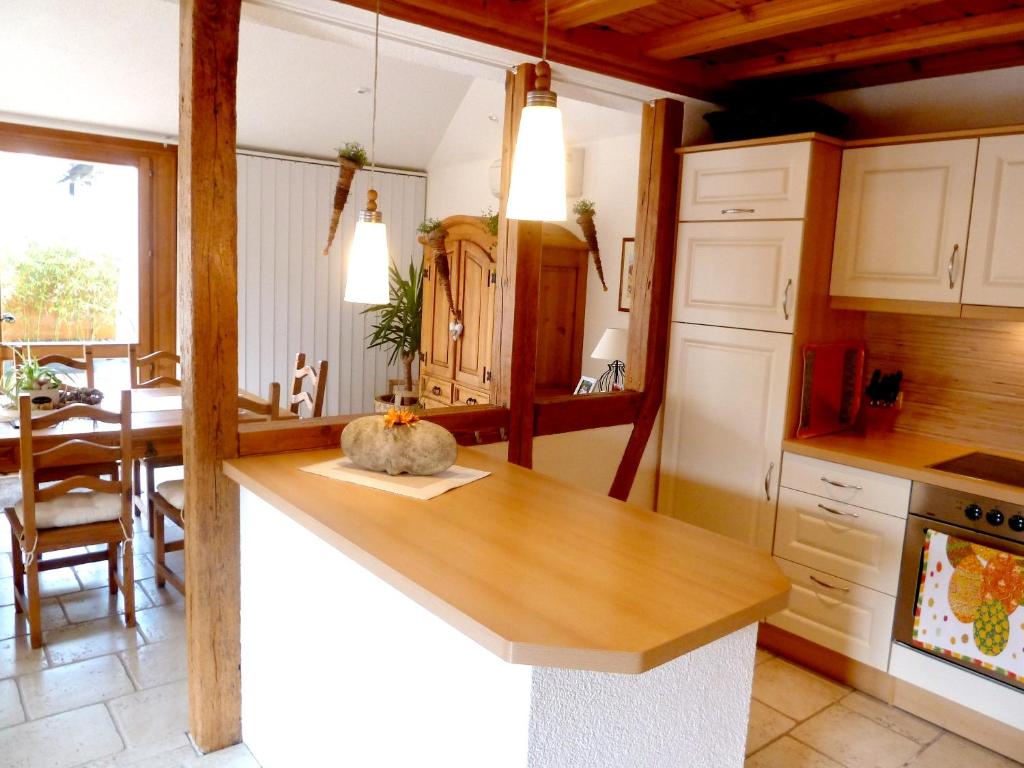 a kitchen with a counter and a dining room at Appartement de 2 chambres avec jardin clos et wifi a Beblenheim in Beblenheim