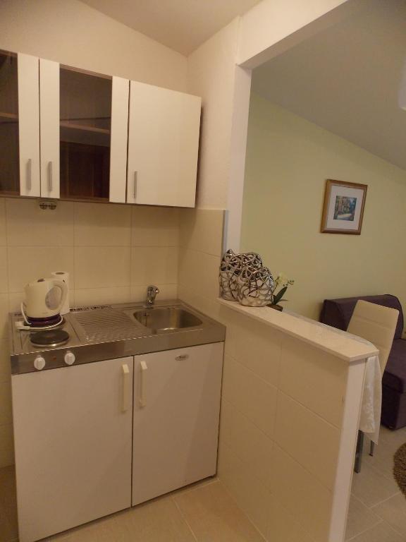 Kuchyň nebo kuchyňský kout v ubytování Rooms Valentino