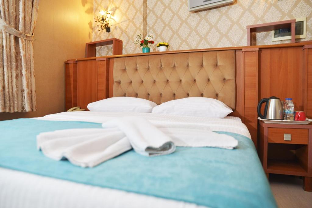 Postel nebo postele na pokoji v ubytování Old City Viva Hotel