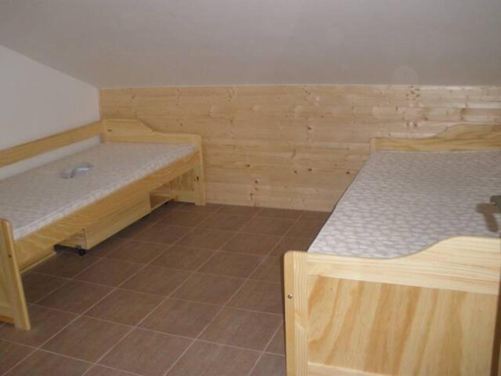 Postel nebo postele na pokoji v ubytování Cihlářka v Krkonoších - Apartmán 206