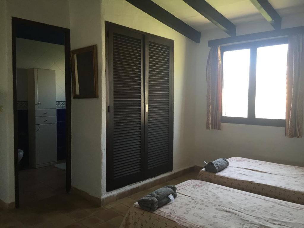 Postel nebo postele na pokoji v ubytování Cala Serena Beach