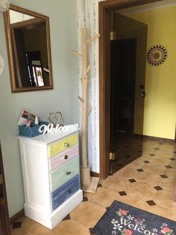 a room with a dresser and a mirror at Haus Zissi in Burg-Reuland