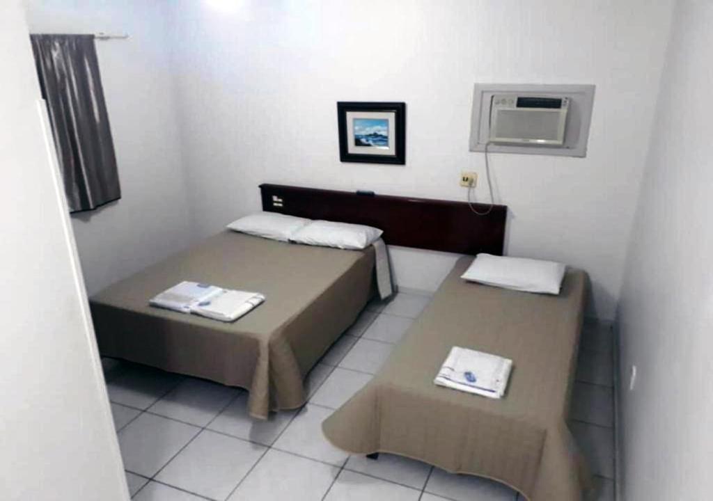 Postel nebo postele na pokoji v ubytování Hotel Fratelli