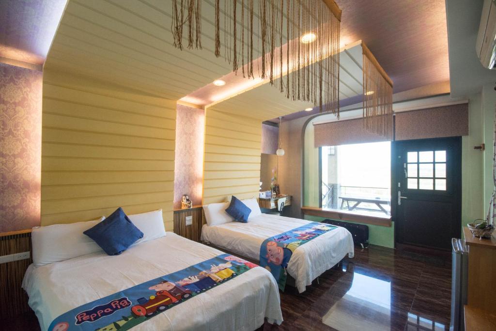 Postel nebo postele na pokoji v ubytování Lanyang Beach Villa
