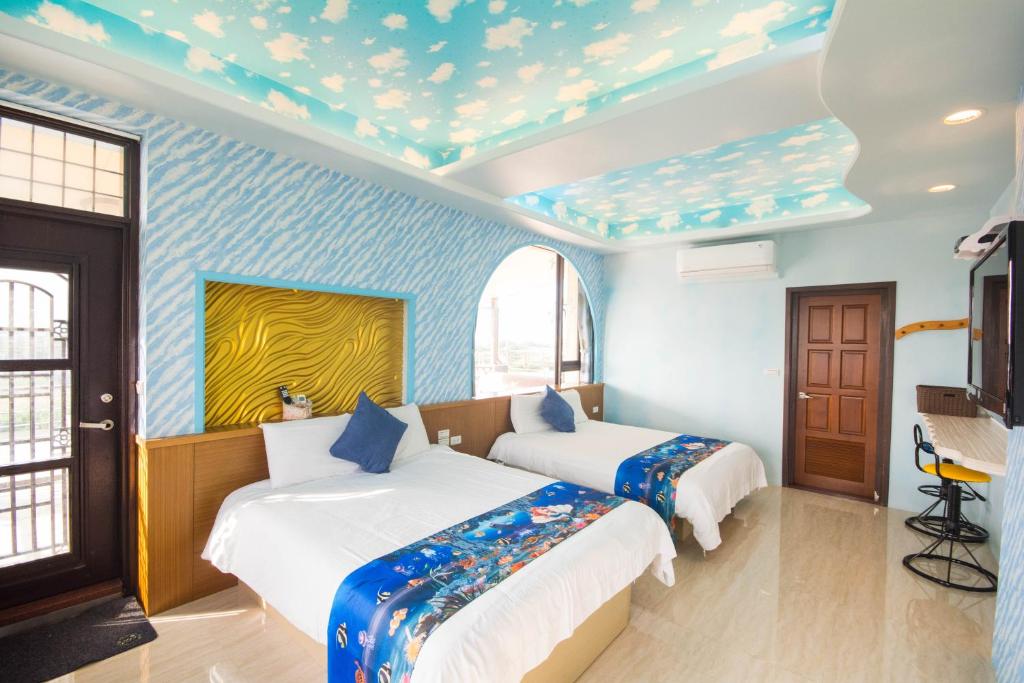 Postel nebo postele na pokoji v ubytování Lanyang Beach Villa