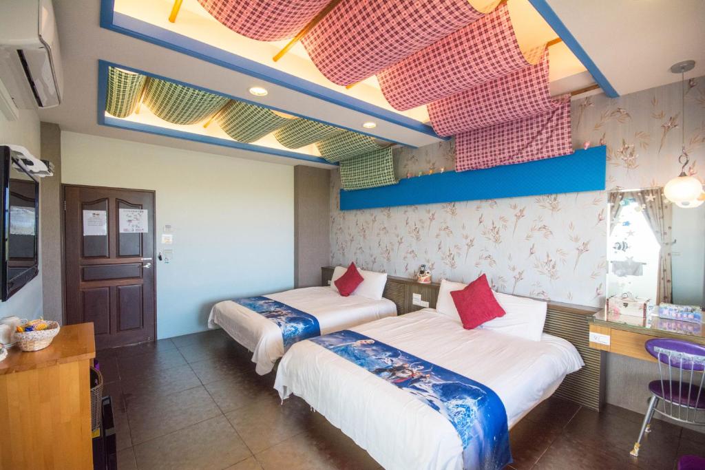 Postel nebo postele na pokoji v ubytování Lanyang Beach Villa