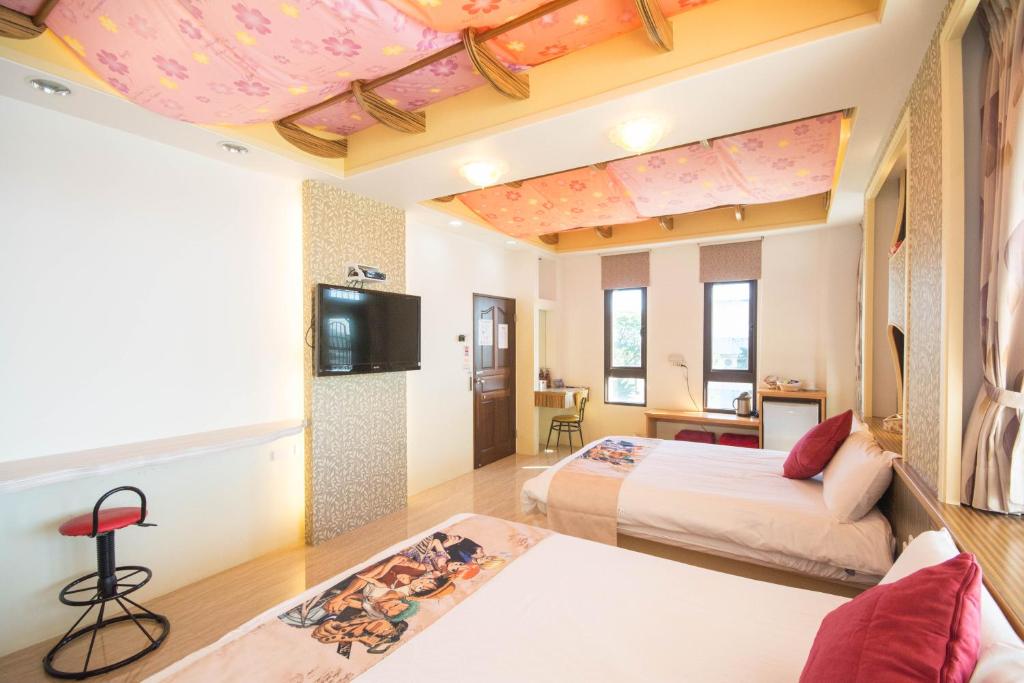 Postel nebo postele na pokoji v ubytování Lanyang Beach Villa