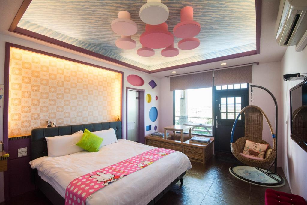 Postel nebo postele na pokoji v ubytování Lanyang Beach Villa