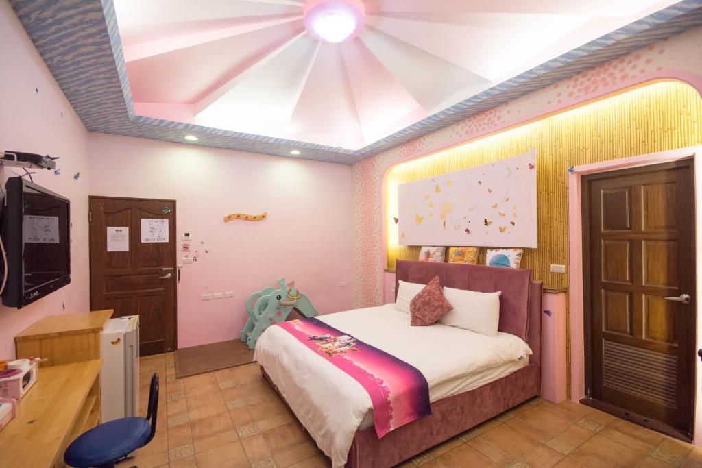 Postel nebo postele na pokoji v ubytování Lanyang Beach Villa
