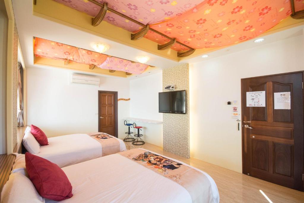 Postel nebo postele na pokoji v ubytování Lanyang Beach Villa