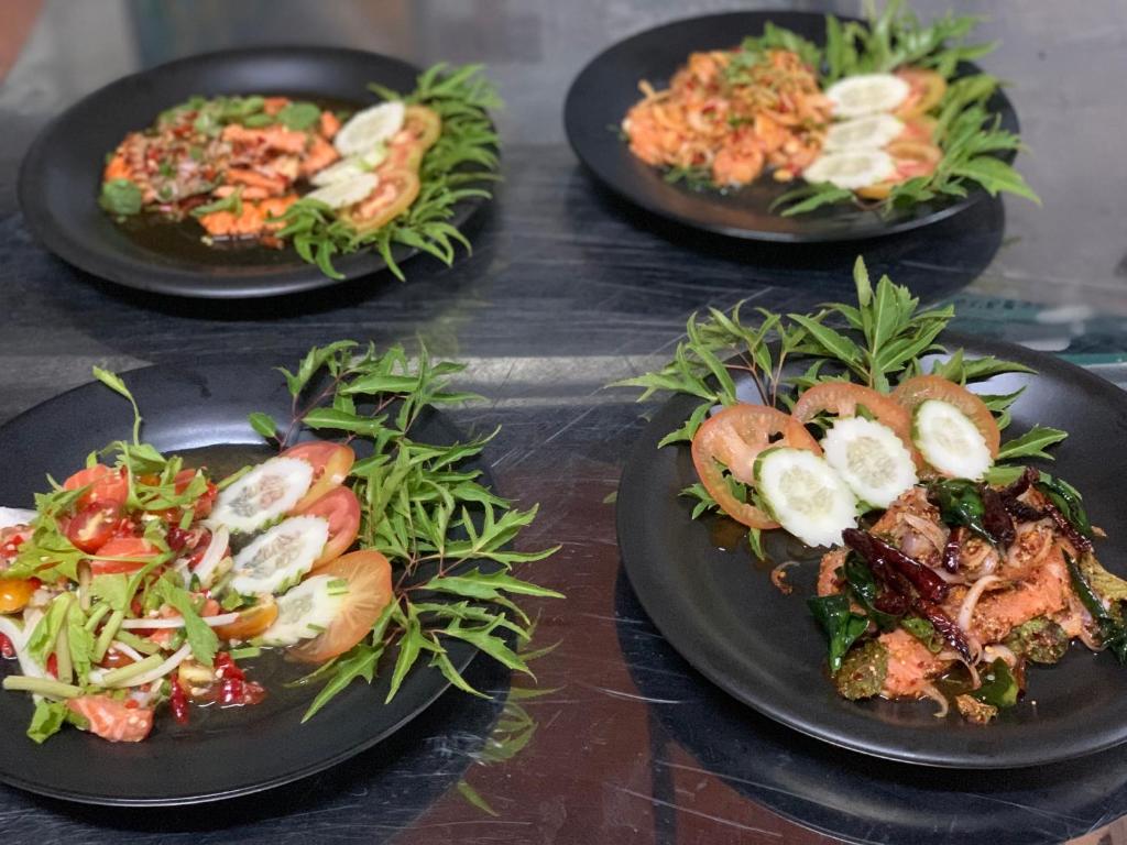 a group of three plates of food on a table at Beck's Resort in Haad Pleayleam
