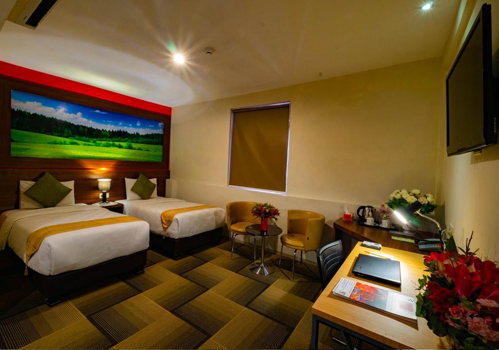 Postel nebo postele na pokoji v ubytování Miyanna Hotel
