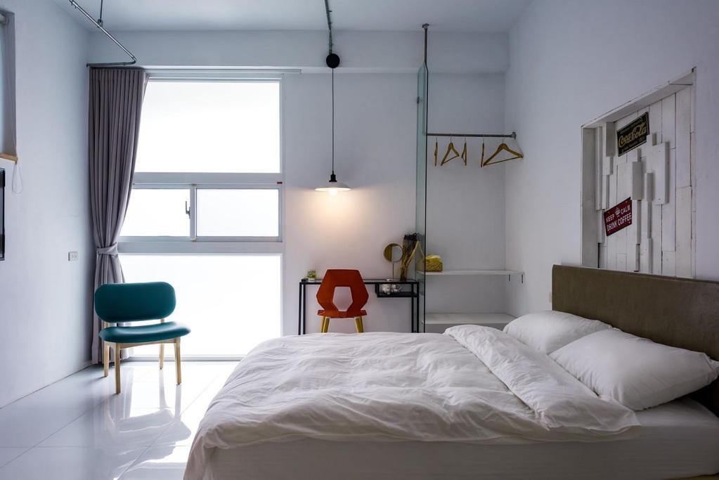 Postel nebo postele na pokoji v ubytování Tainan No 820
