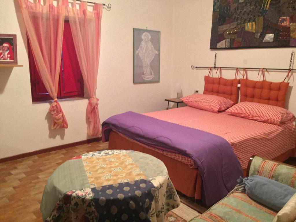 Postel nebo postele na pokoji v ubytování Agriturismo Cailuca
