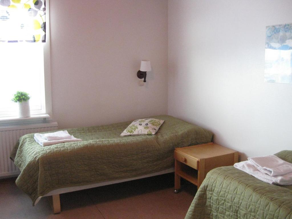 Postel nebo postele na pokoji v ubytování Hotell Samegård