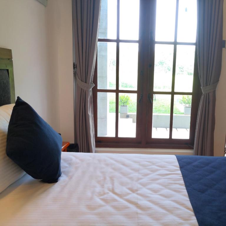 Postel nebo postele na pokoji v ubytování Kudila Resort