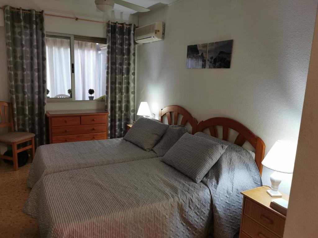 Postel nebo postele na pokoji v ubytování EDIFICIO APOLO 4