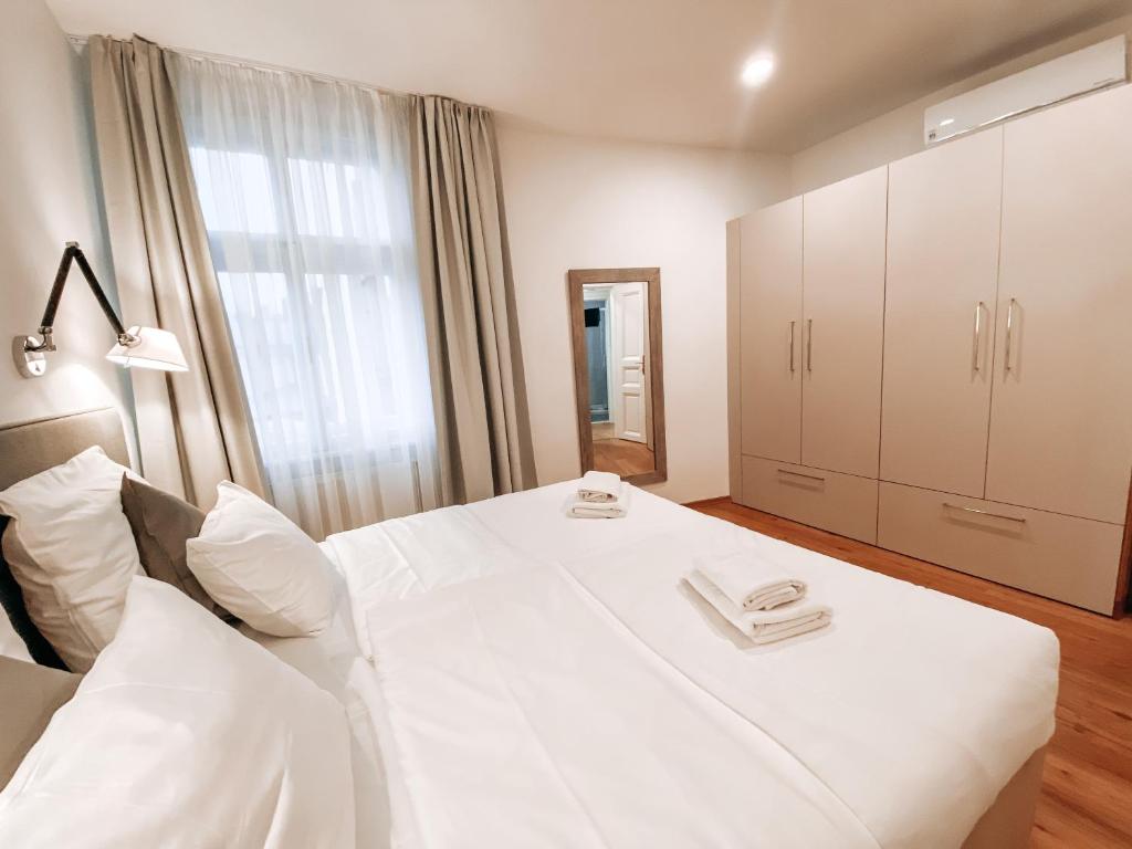 Postel nebo postele na pokoji v ubytování Residence Masna