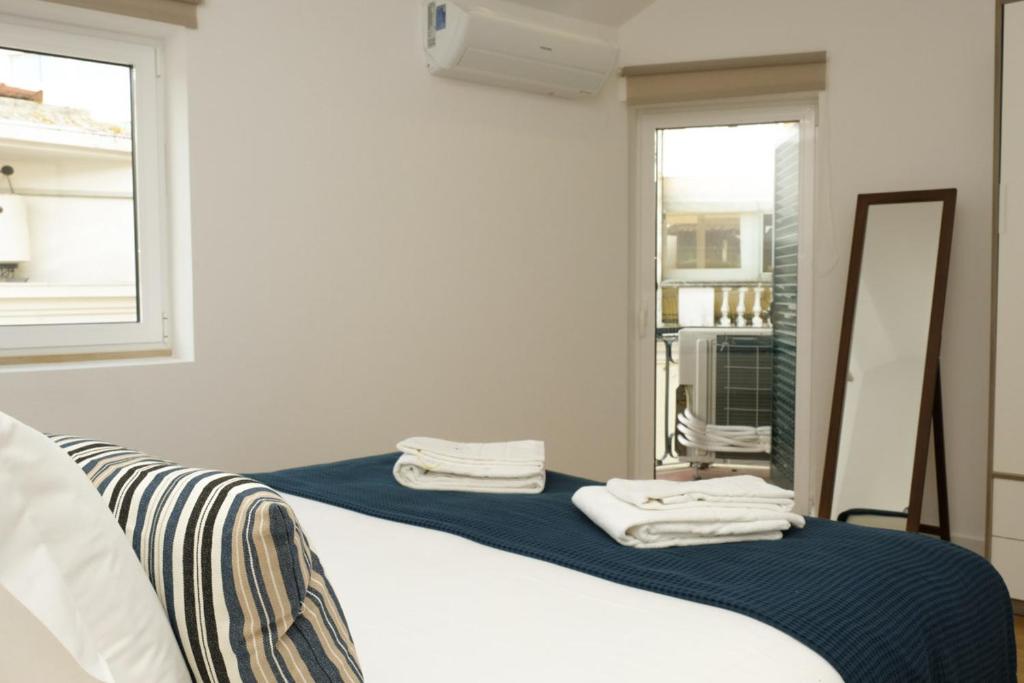 Postel nebo postele na pokoji v ubytování Love apartment Beco Torto, Cascais