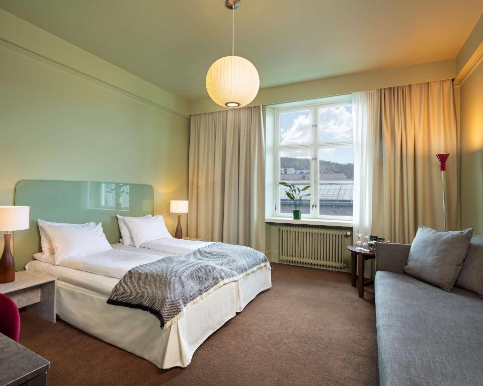 Postel nebo postele na pokoji v ubytování Grand Hotel Terminus