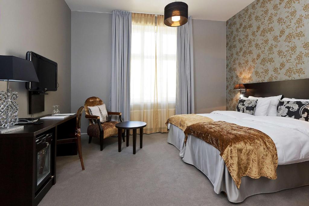 Postel nebo postele na pokoji v ubytování Saga Hotel Oslo, WorldHotels Crafted