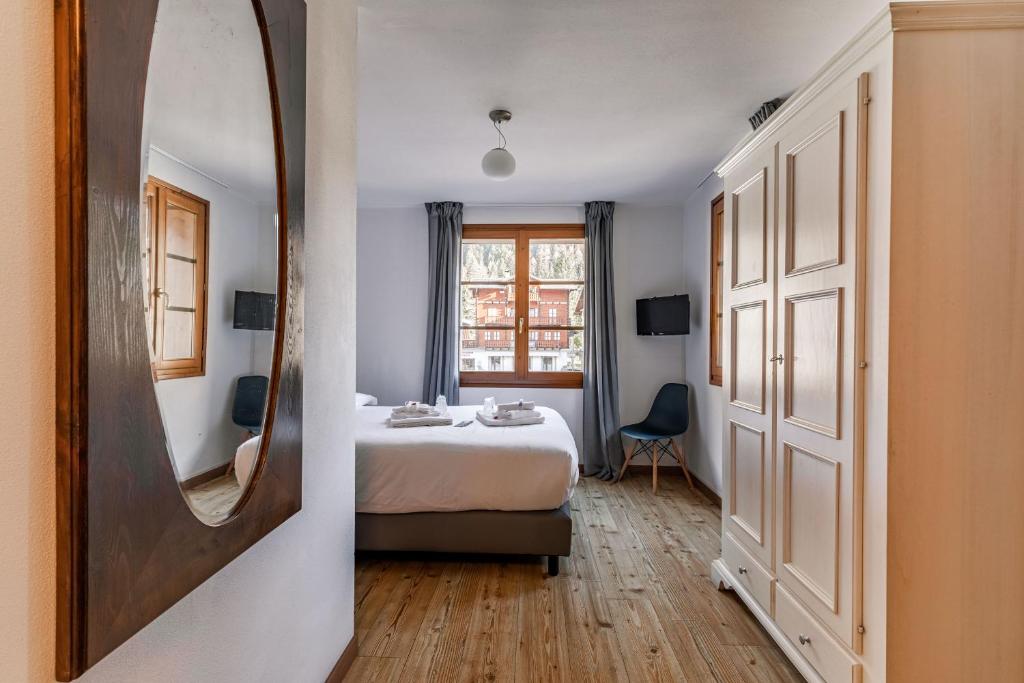 Postel nebo postele na pokoji v ubytování Hotel Dufour