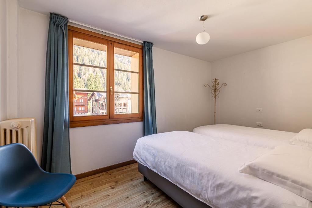 Postel nebo postele na pokoji v ubytování Hotel Dufour