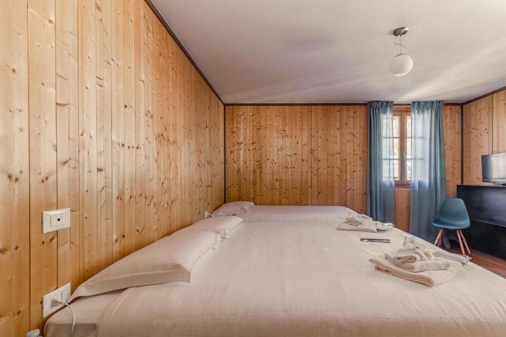 Postel nebo postele na pokoji v ubytování Hotel Dufour