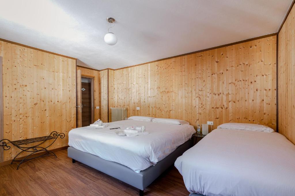 Postel nebo postele na pokoji v ubytování Hotel Dufour