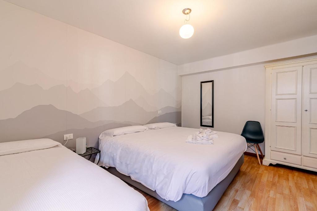 Postel nebo postele na pokoji v ubytování Hotel Dufour