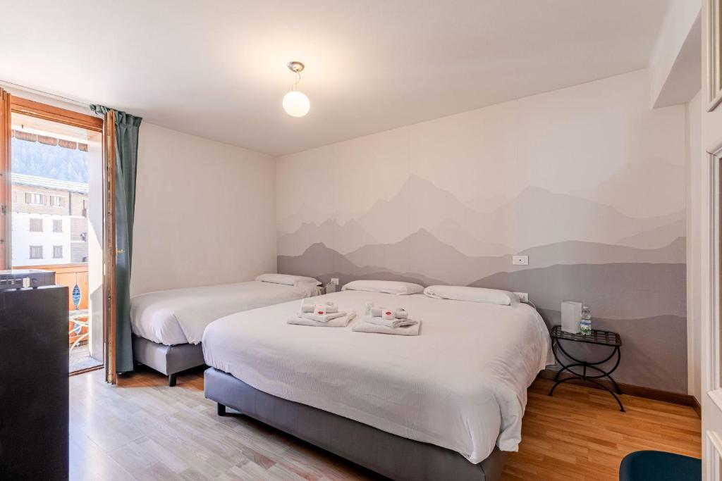 Postel nebo postele na pokoji v ubytování Hotel Dufour