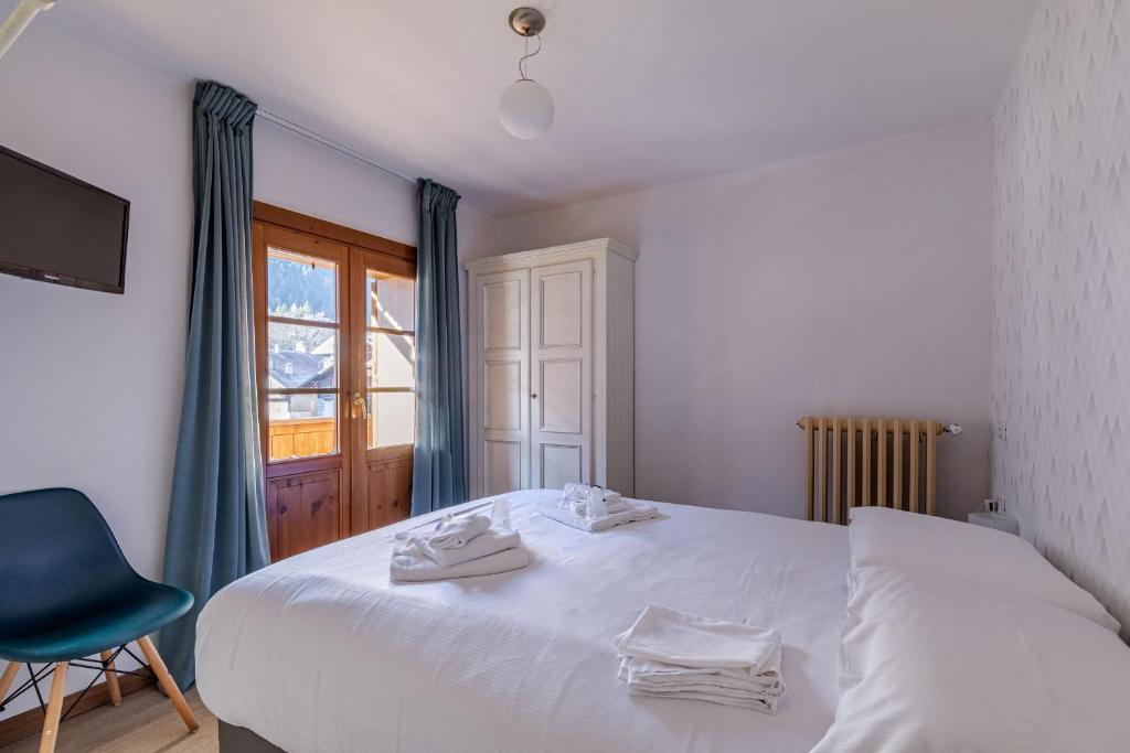 Postel nebo postele na pokoji v ubytování Hotel Dufour