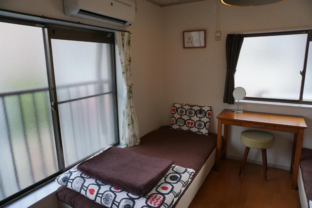 Postel nebo postele na pokoji v ubytování Guesthouse Ten-roku - Female Only