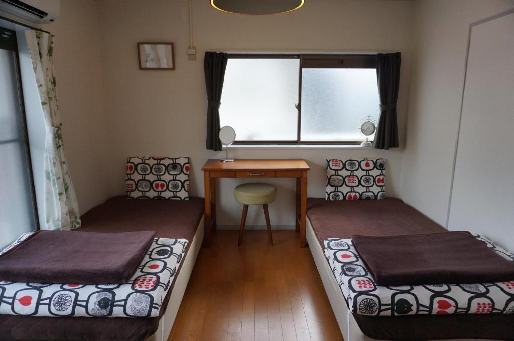 Postel nebo postele na pokoji v ubytování Guesthouse Ten-roku - Female Only