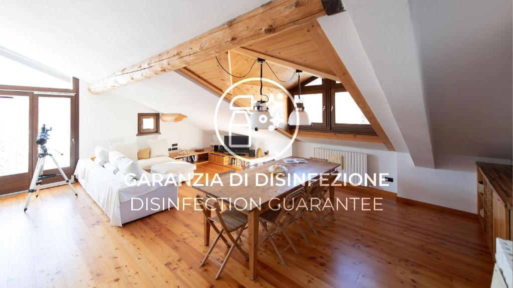 a living room with a couch and a table at Italianway - Sertorelli 60 in Bormio