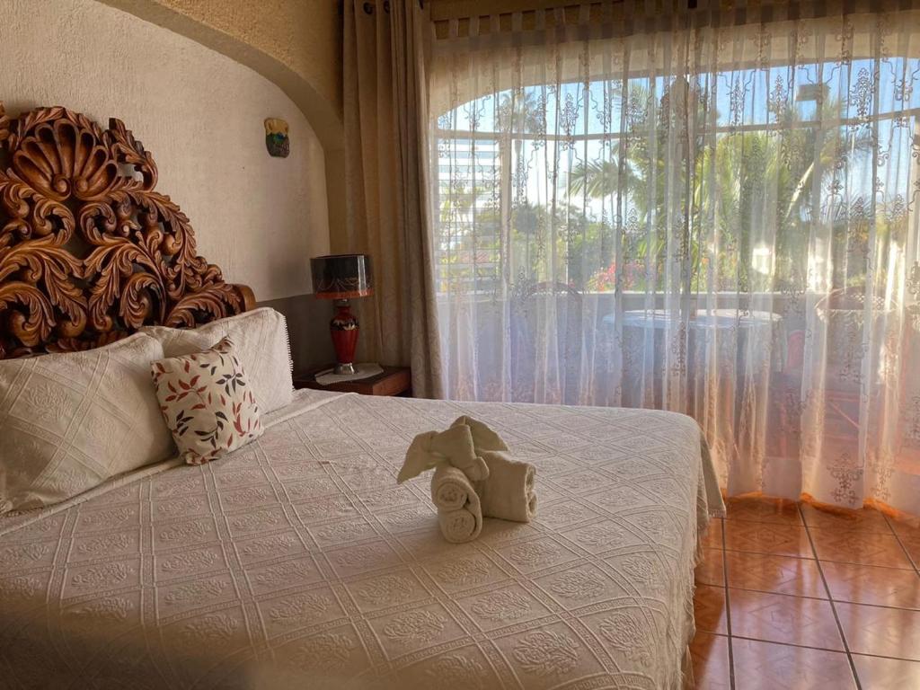 A bed or beds in a room at Casa de la Abuela