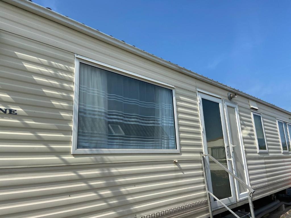 an exterior view of an rv with a window at Lake District Static Caravan Lakeside Cumbria in Millom