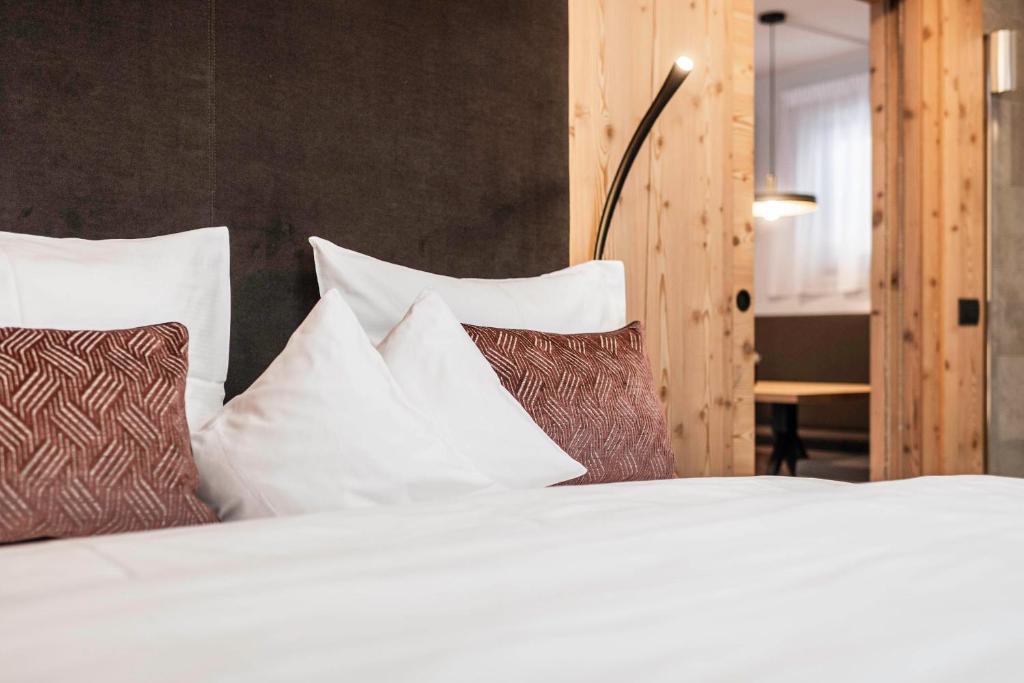 Łóżko lub łóżka w pokoju w obiekcie LaMonte Premium Apartments by Feuerstein