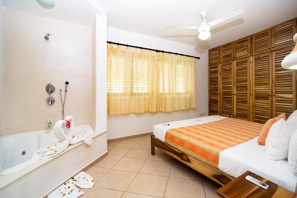Postel nebo postele na pokoji v ubytování Albachiara Hotel - Las Terrenas
