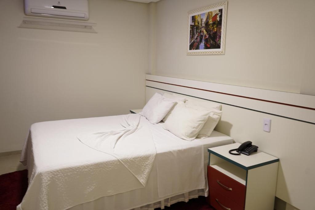 Postel nebo postele na pokoji v ubytování Pak Suítes Hotel