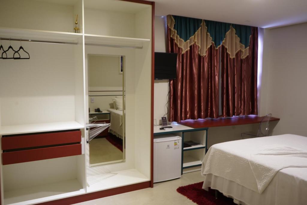 Postel nebo postele na pokoji v ubytování Pak Suítes Hotel