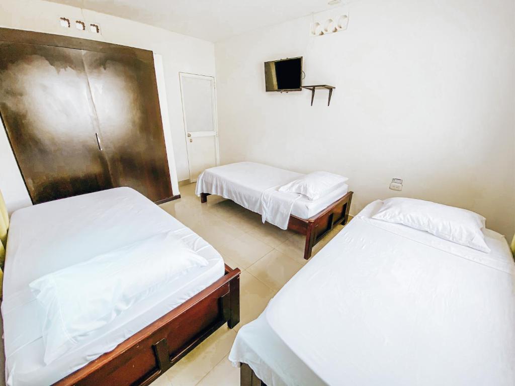 Postel nebo postele na pokoji v ubytování Miss Julyn Sweet Home